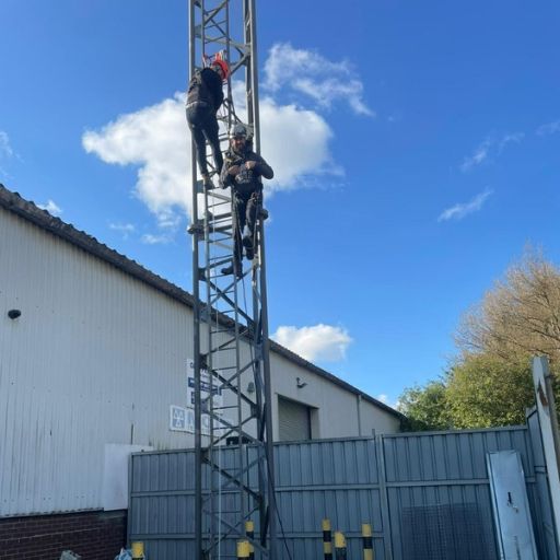 TRI Services undertaking height safety training climbing a scaffold rig